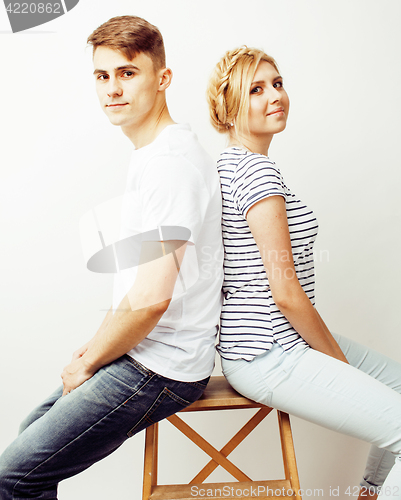 Image of young pretty teenage couple, hipster guy with his girlfriend happy smiling and hugging isolated on white background, lifestyle people concept 