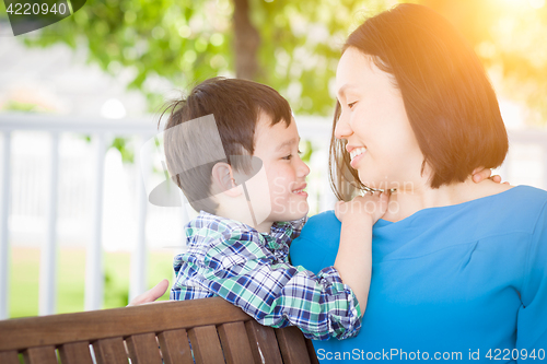Image of Outdoor Portrait of Chinese Mother with Her Mixed Race Chinese a