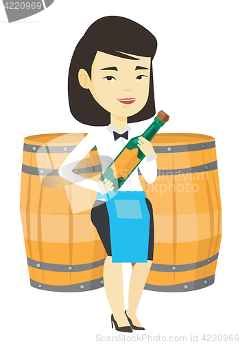 Image of Waitress holding bottle of alcohol.