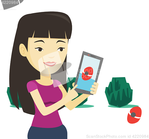 Image of Woman playing action game on smartphone.