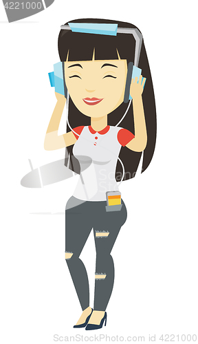 Image of Young woman in headphones listening to music.