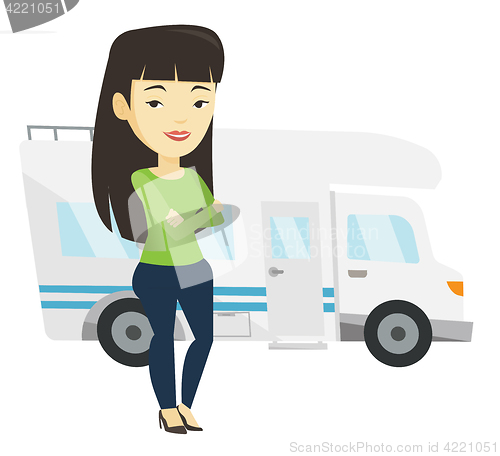 Image of Woman standing in front of motor home.