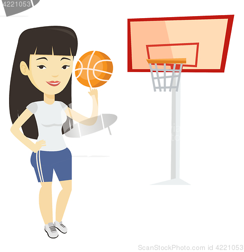 Image of Young basketball player spinning ball.