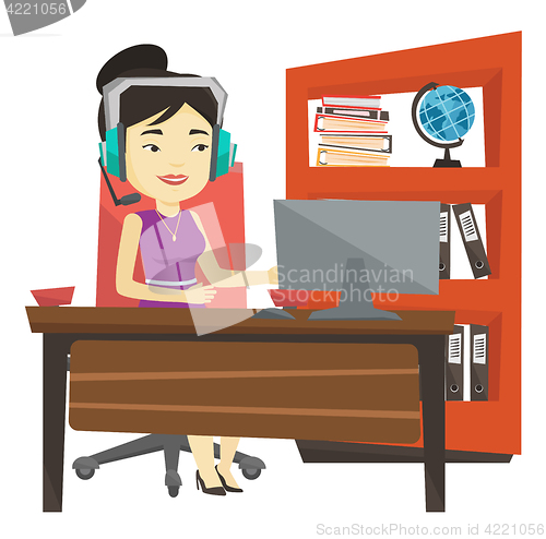 Image of Business woman with headset working at office.