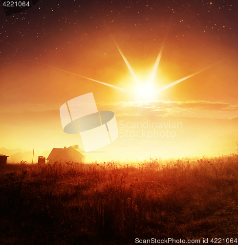 Image of sunrise with fog over countryside