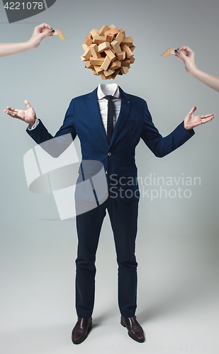 Image of Businessman with Game Cube box instead of head