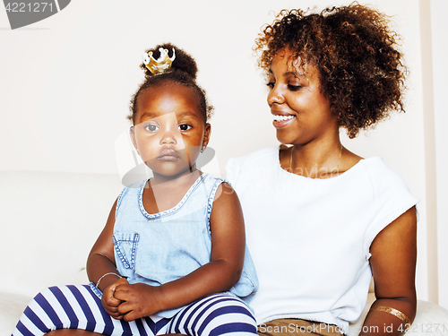 Image of adorable sweet young afro-american mother with cute little daughter, hanging at home, having fun playing smiling, lifestyle people concept, happy smiling modern family 