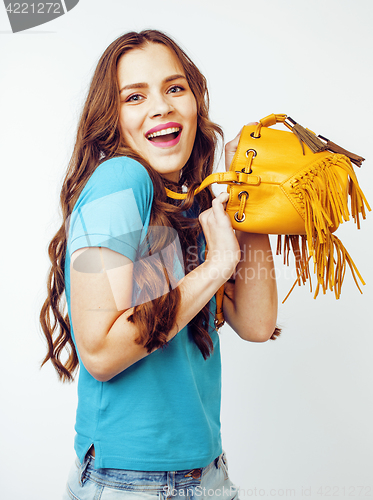 Image of young pretty long hair woman happy smiling isolated on white background, wearing cute tiny fashion handbag, lifestyle people concept