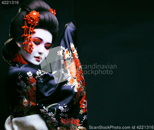 Image of young pretty geisha in kimono