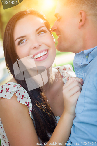 Image of Happy Mixed Race Romantic Couple Portrait in the Park.