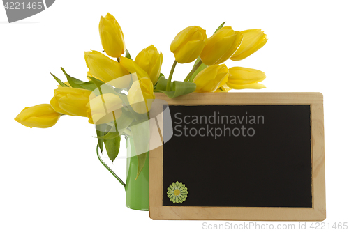 Image of Yellow tulips and blank blackboard