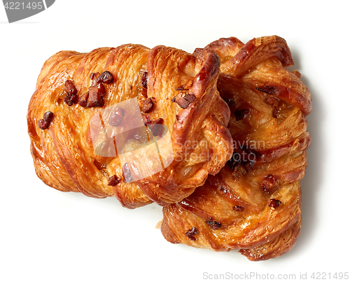 Image of freshly baked pecan buns isolated on white