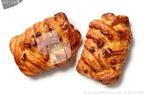 Image of freshly baked pecan buns isolated on white