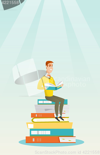 Image of Student sitting on huge pile of books.