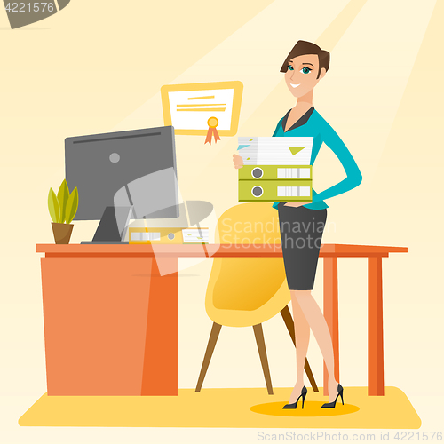 Image of Office worker holding pile of folders.