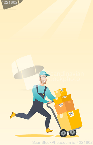 Image of Delivery postman with cardboard boxes on trolley.