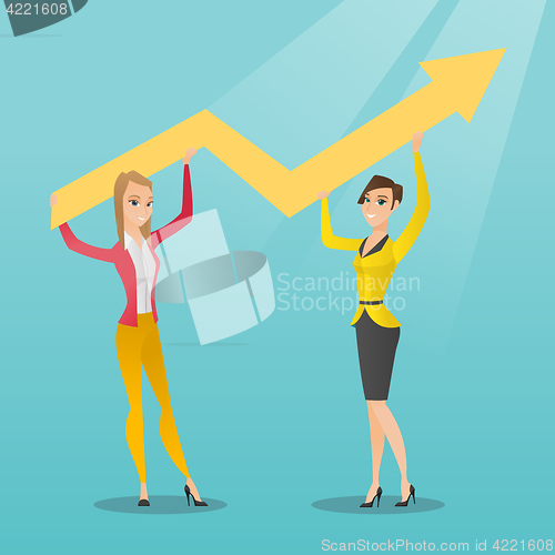 Image of Two business women holding growth graph.