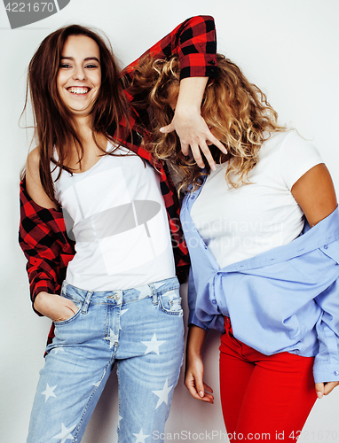 Image of lifestyle people concept: two pretty stylish modern hipster teen girl having fun together, happy smiling making selfie