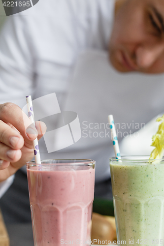 Image of Male chef serving smoothies