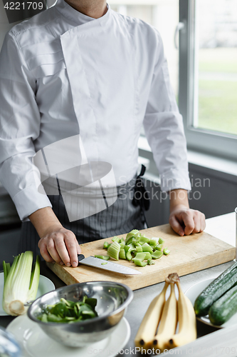 Image of Crop shot of chef making vegetable smoothie