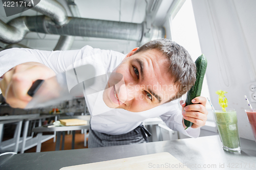 Image of Young male chef having fun