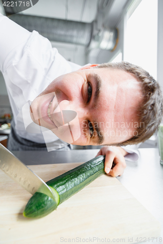 Image of Young male chef having fun