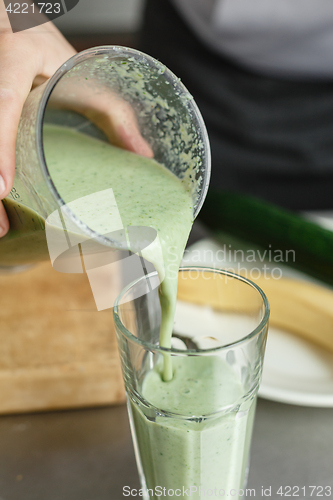 Image of Crop shot of male pouring smoothie