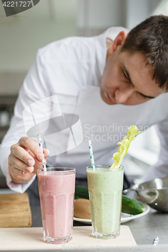 Image of Male chef serving smoothies