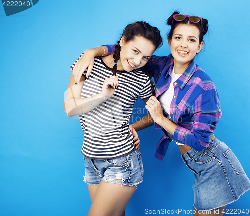 Image of best friends teenage school girls together having fun, posing emotional on blue background, besties happy smiling, lifestyle people concept 