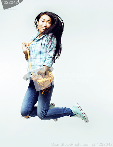Image of young pretty jumping asian woman posing cheerful emotional isolated on white background, lifestyle people concept 