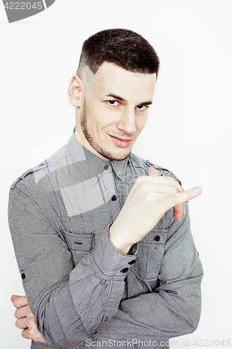 Image of young handsome well-groomed guy posing emotional on white background, lifestyle people concept 