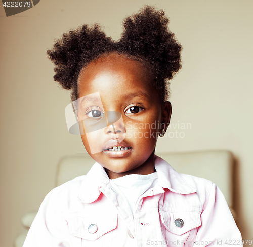 Image of little cute sweet african-american girl playing happy with toys 