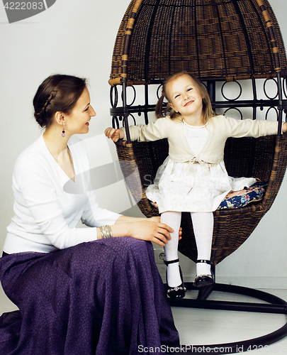 Image of young mother with daughter at luxury home interior vintage