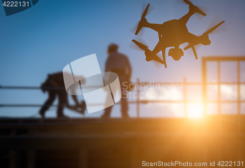 Image of Silhouette of Unmanned Aircraft System (UAV) Quadcopter Drone In