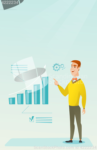Image of Successful businessman pointing at chart going up.