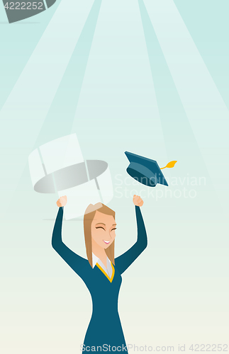 Image of Graduate throwing up graduation hat.