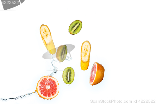 Image of Fresh fruits falling in water splash, isolated on white background