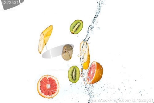 Image of Fresh fruits falling in water splash, isolated on white background