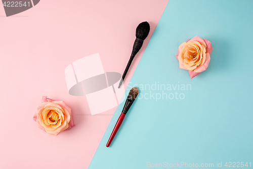 Image of Make up brushes on colorful background