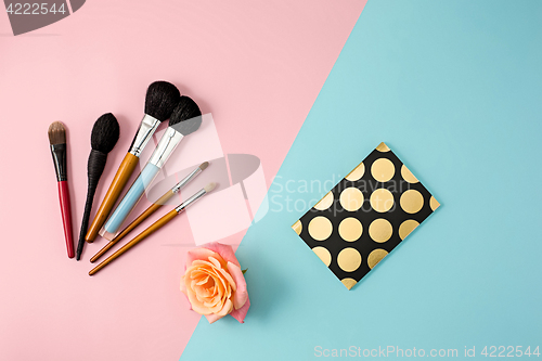 Image of Make up brushes on colorful background