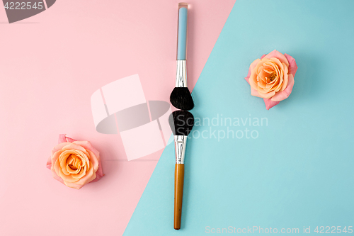 Image of Make up brushes on colorful background