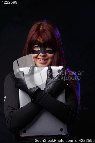 Image of Cheerful thief in black gloves