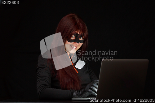 Image of Burglar in mask at night