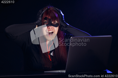 Image of Brunette steals information from computer