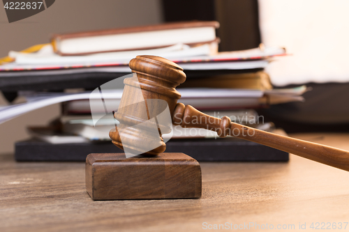 Image of Paper, hammer on wooden table