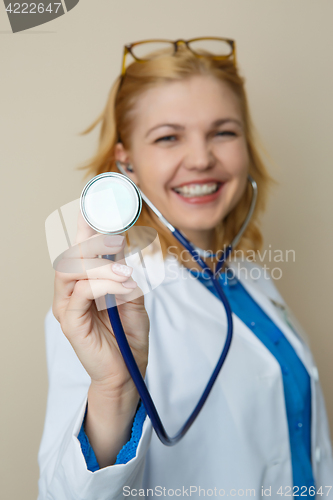 Image of Beautiful woman in medical dressingbackground