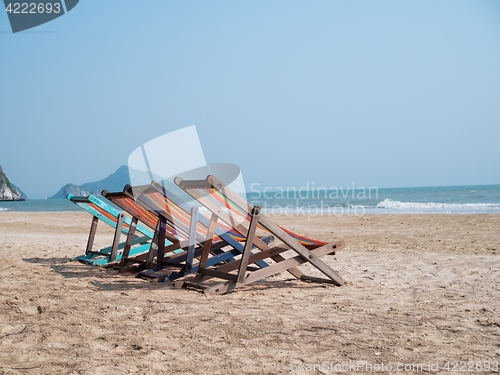 Image of Sandy beach with chaise lounges