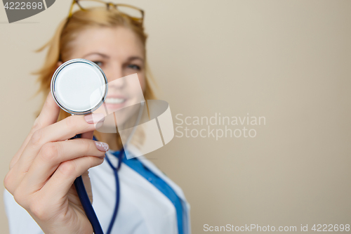 Image of Blonde in glasses with phonendoscope