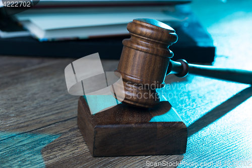 Image of Judge\'s hammer on wooden table