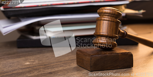 Image of Hammer judge next to folder